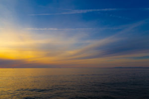 日本海と夕焼けと青空の写真素材